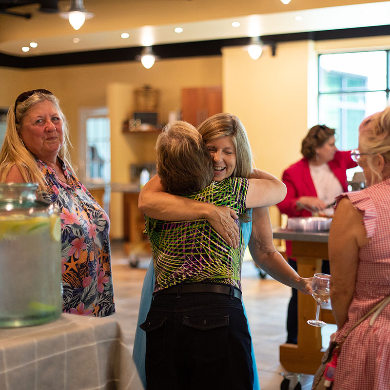 People hugging in the Thought design culinary kitchen