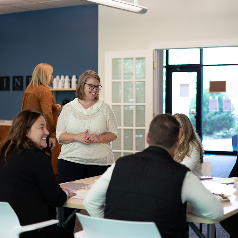 Tara smiling at attendants at a Thought Design Leadership development training